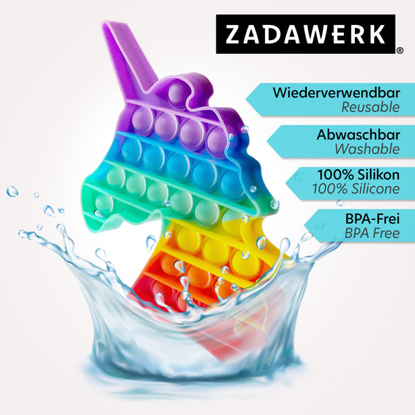 Der bunte Einhornkopf steht in überschwappendem Wasser. Produktmerkmale: wiederverwendbar, abwaschbar, 100% Silikon, BPA-frei.