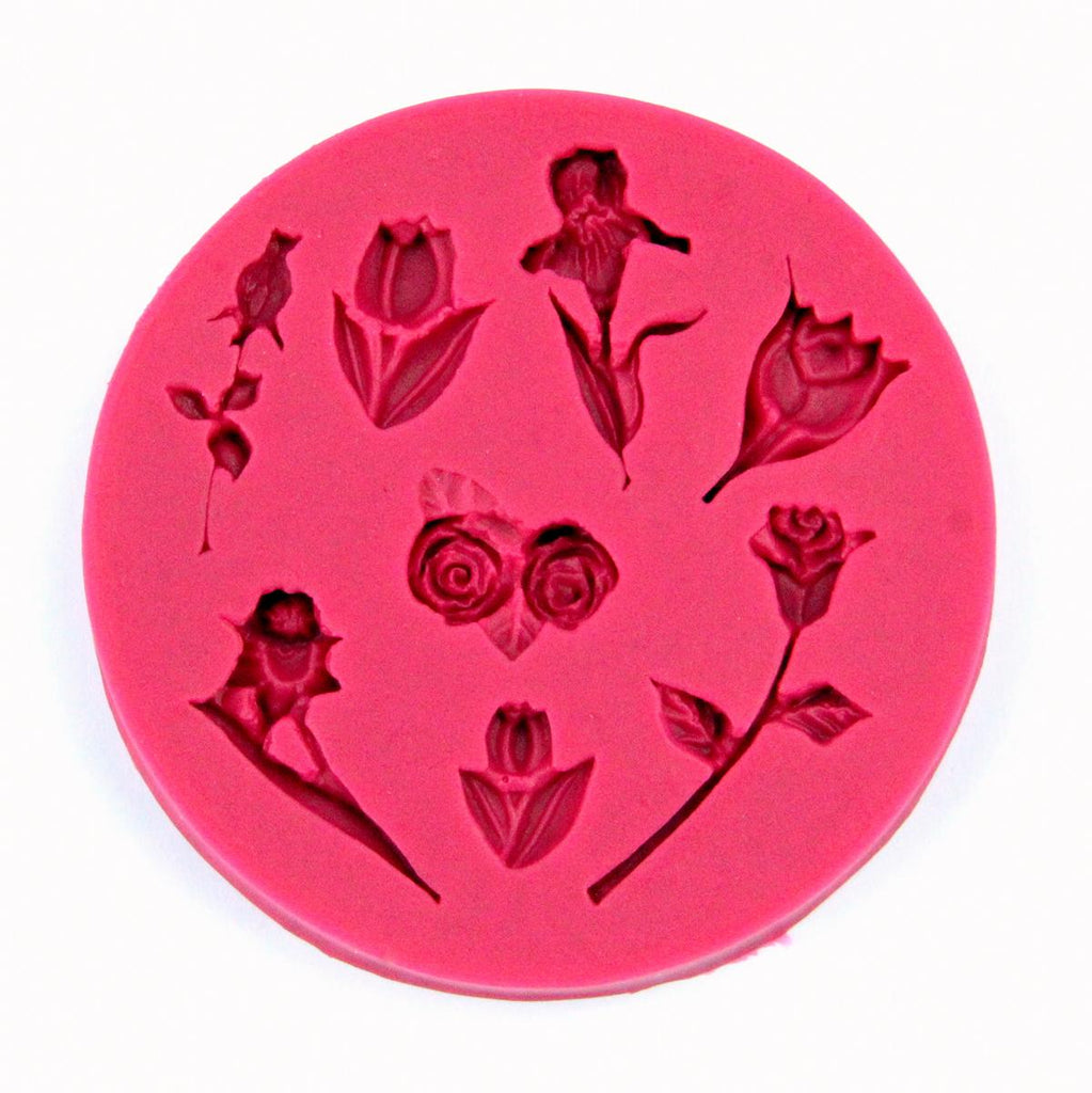 Die Silikonform 037 für Fondant, Marzipan oder Modelliermasse mit 8 verschiedenen Blumenmotiven (Rose, Tulpe, Orchidee) von oben gesehen