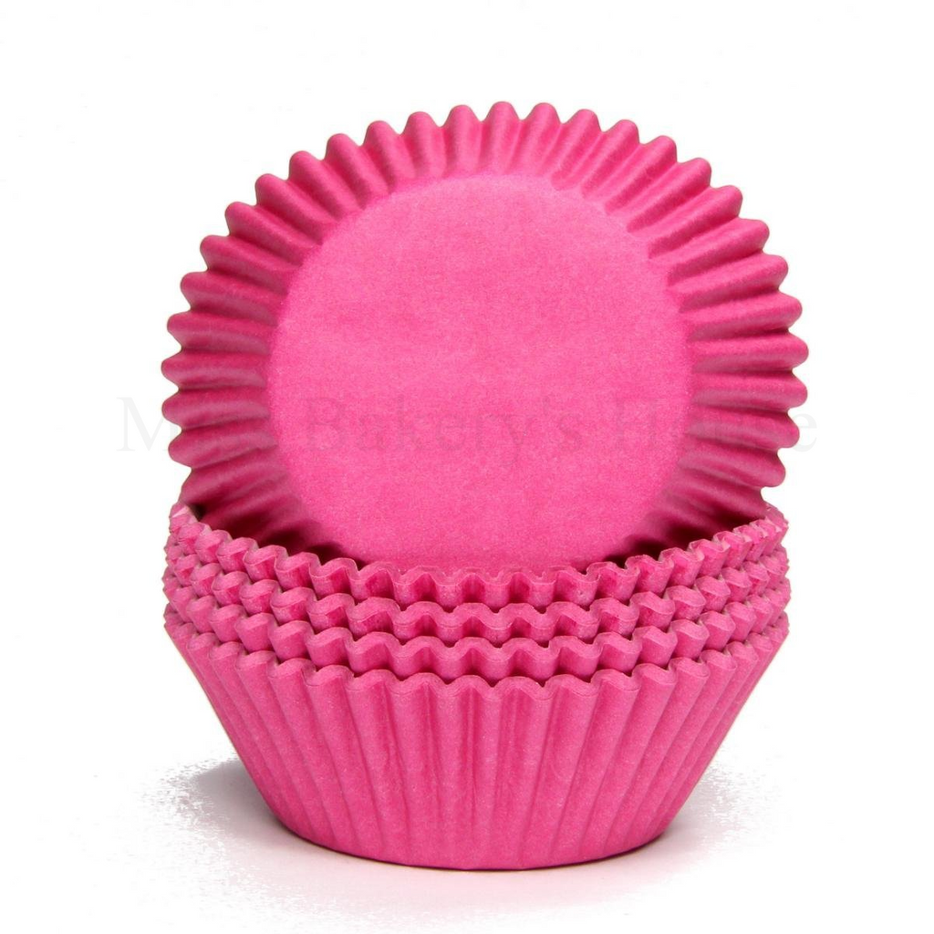 Pink farbene Papierbackförmchen für Muffins und Cupcakes in Standardgröße.